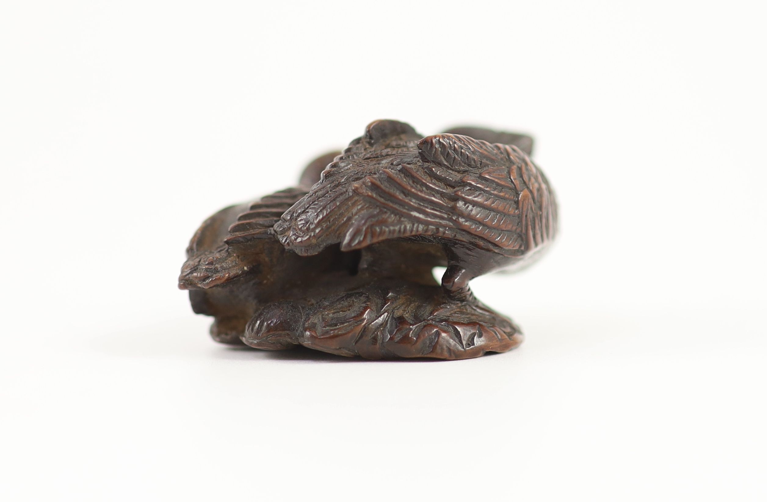 A Japanese wood netsuke of a male and female mandarin duck (oshidori), School of Yamaguchi Okatomo, 19th century, 4cm long